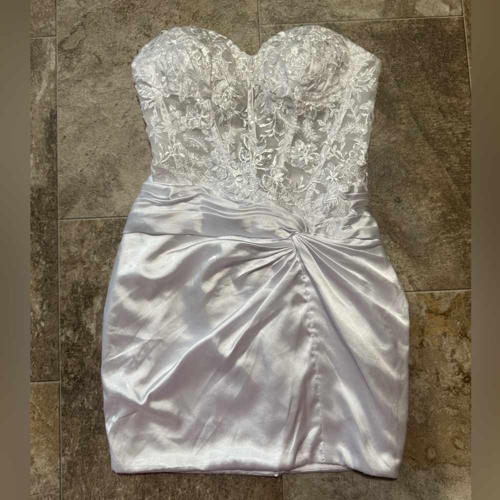 White strapless, mini bridal dress with a lace bodice & satin skirt.
